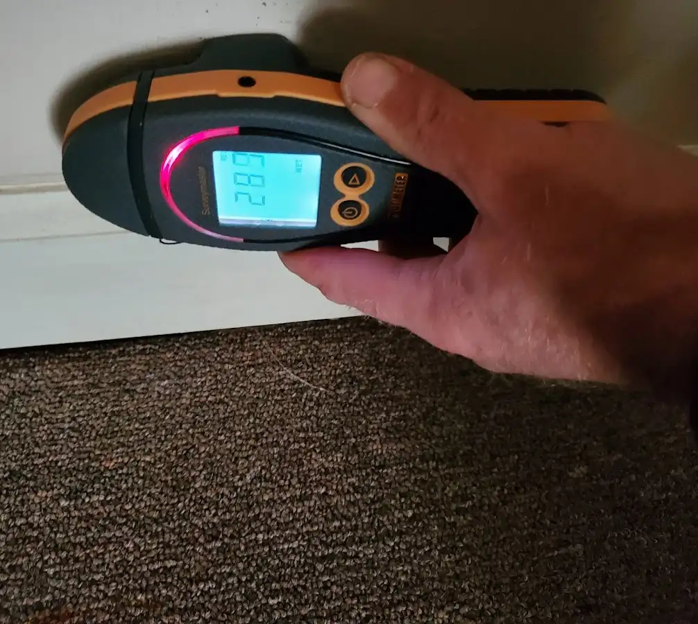 Moisture detection at baseboard during Storm Damage Restoration in Fort Meade